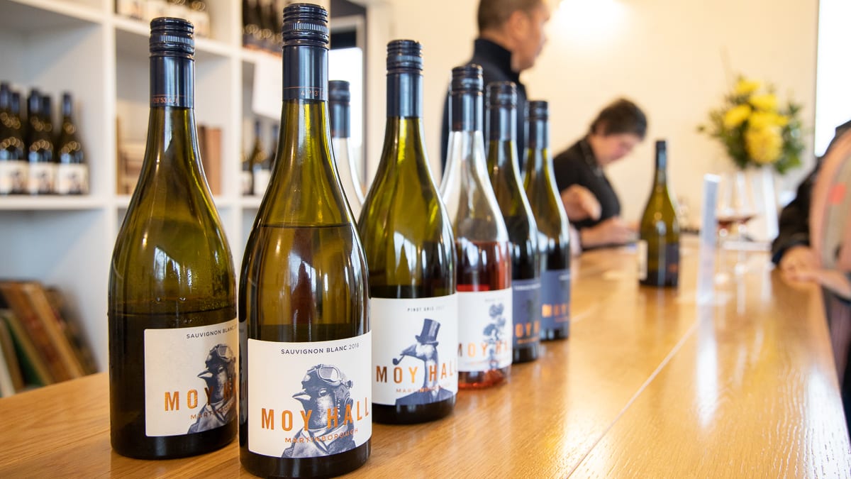 Bottles lined up for tasting on the bar at Moy Hall in Martinborough