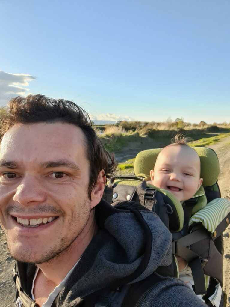 James Howells out on a walk with a baby on his back